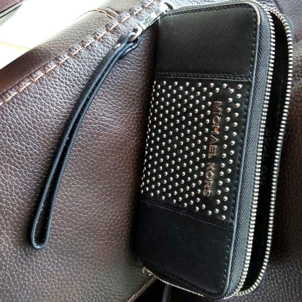 Black studded Michael kors wristlet, used